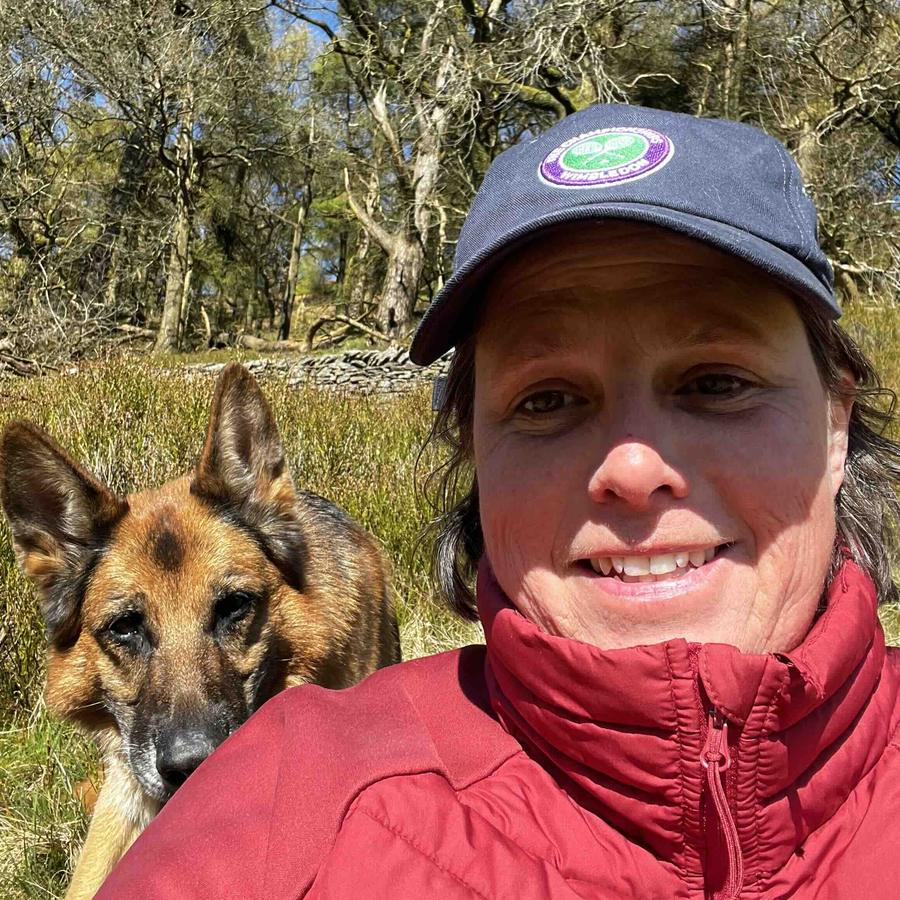 Tor Davies, founder of Co-Kinetic, outdoors with her dog Lupa